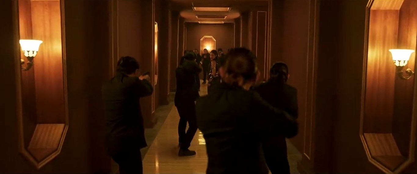 sri asih faces nine guys in the hallway.jpg