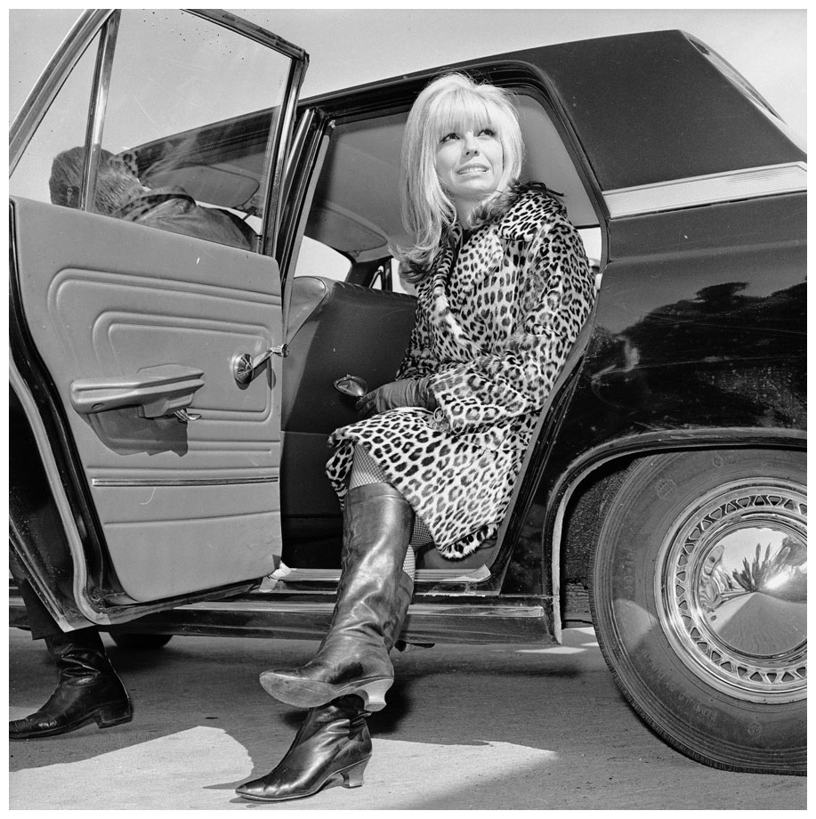 american-singer-nancy-sinatra-gets-out-of-a-car-wearing-a-leopard-skin-coat-and-knee-length-boots-photo-by-central-pressgetty-images-1966.jpg